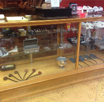 The wood and glass display counter inside Dave and Sons